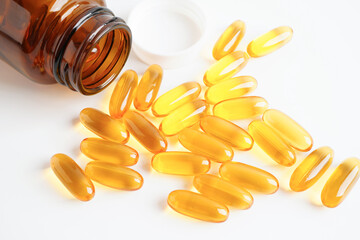 Fish oil or Cod liver oil gel in capsules with omega 3 vitamins, supplementary healthy food