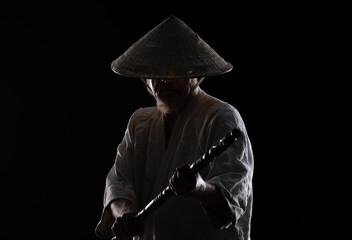 samurai monk in a white kimono on a black background