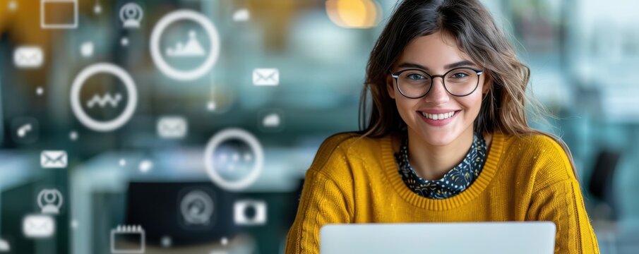 A young woman using a laptop with floating social media icons in a modern office.