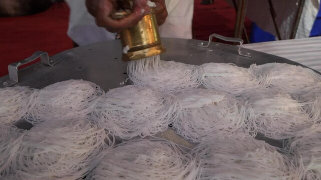 Process of cooking diyappam also known as string hopper, indiappa noolputtu nool