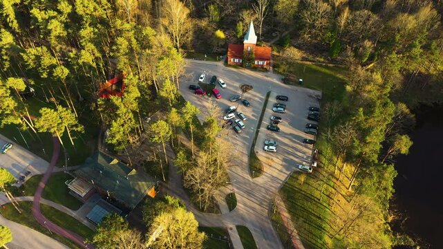 Top-Down View of Parking Lot and Church in Valmiera, Latvia near Janis Dalins Stadium