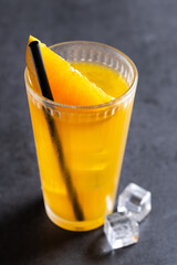 Orange vodka cocktail on black slate background.cocktail screwdriver