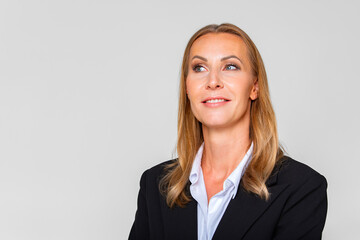 Beautiful blonde woman bank employee. A woman thinks a good idea. Close-up of a woman in a business...