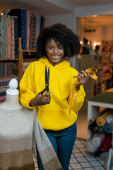 African american girl in her sewing workshop.