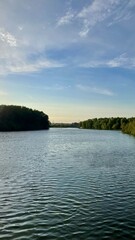 A landscape with a view of the river and the sunset