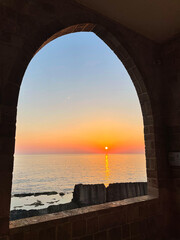 Beautiful arch window with a sunset view
