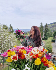 young lady with ahuge bouquet of flowers