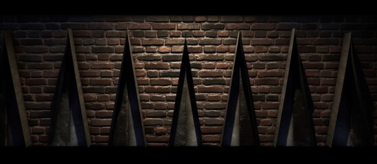 Naklejka premium Triangular Shapes Against Brick Wall