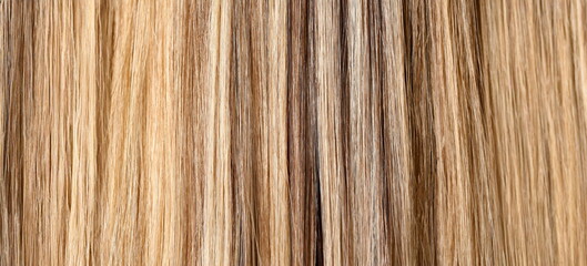 Naklejka premium Woman hair dyeing in salon closeup pattern background
