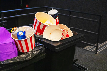 Throw disposable packaging into the trash after pop-con after a movie show. Family weekend