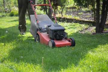 Lawn mover on green grass. Machine for cutting lawns.