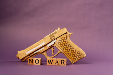 purple warm background with shadows woman put wooden cubes with black letters and laid out the word...