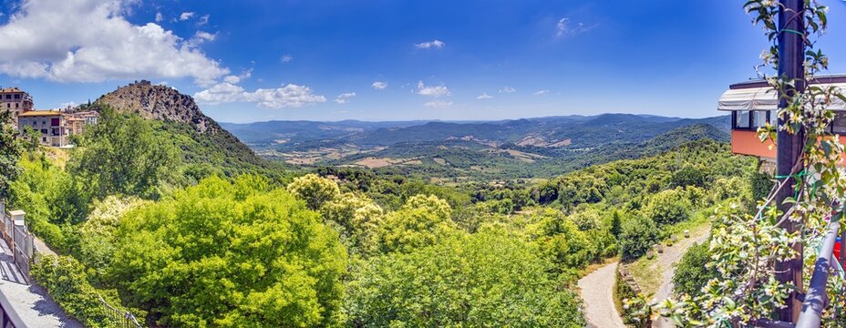 Panoramic view of the Italian town of Tolfa over the surrounding mountains during the day