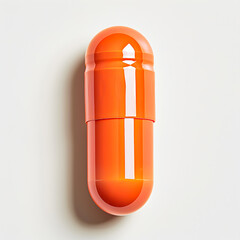 Bright orange capsule pill on white background, representing medication, healthcare, and pharmaceutical concepts.