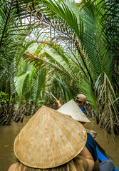 Narrow River ride in canoe in north Vietnam through lush green cover