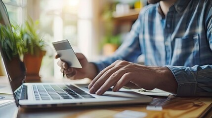 Man use labtop with online shopping digital cart with credit card for shopping payment online with application.Intelligent E-commerce internet banking payment financial technology