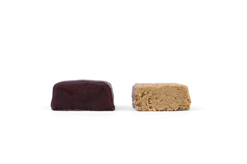 Halva sweets in chocolate isolated on white background.