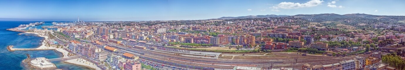 Obraz premium Drone panorama over the Italian city of Civitavecchia with harbor and cruise ships during the day