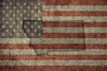 map of montana state and flag of united states of america on a old vintage crack paper background .