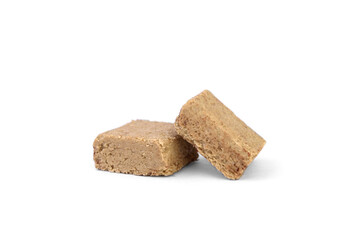Piece of halva isolated on white background.