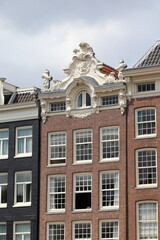 Amsterdam Prinsengracht Canal House Facade with Sculpted Roof Decoration, Netherlands