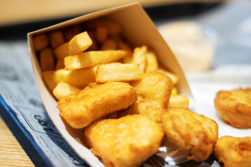 A delicious spread of crispy chicken nuggets and golden french fries on a table