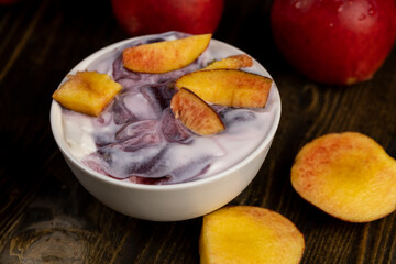 natural yogurt in a white bowl with fruits