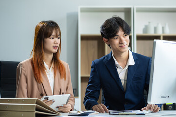 Businessmen team or financial data analysts working with tablets and laptop computers and data graphs together. Plan to analyzing projects in the office.