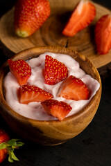 yogurt made from milk with added flavor and pieces of ripe strawberries
