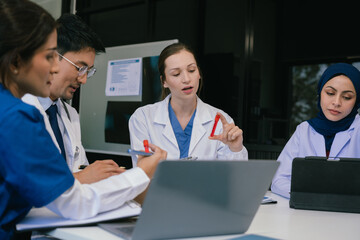 Doctor team, analysis the blood test examination results and medication usage of the patient on the chart, medical check-up concept.