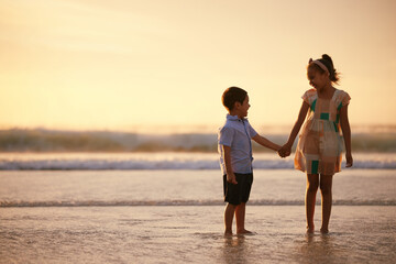 Beach, hug and children or siblings holding hands, love and support for childhood on summer vacation. Travel holiday, people together and ocean or nature getaway, care and space for bonding