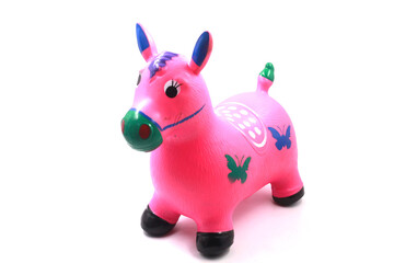 Toy horses are made of rubber isolated on white background