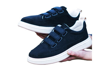 a black shoe in a man's hand