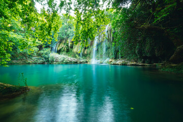 Obraz premium Kursunlu Waterfall. Kursunlu waterfall, which is the charm of nature with the water coming from the mountains in the green rainforests in Turkey.
