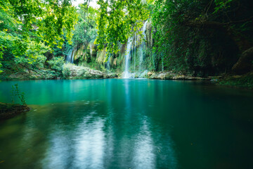 Naklejka premium Kursunlu Waterfall. Kursunlu waterfall, which is the charm of nature with the water coming from the mountains in the green rainforests in Turkey.
