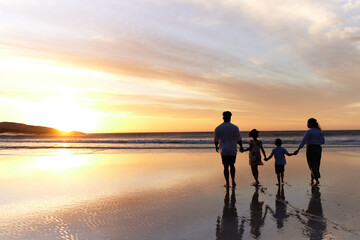 Fototapeta premium Beach, family and sunset with silhouette and holding hands for support, security and parent care. Kids, love and back with travel, holiday and ocean with shadow of mom and dad with sea and mockup