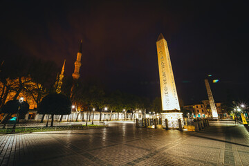 Evening photo of the minaret of the Blue Mosque and the Theodosius Obelisk in Istanbul. Istanbul...
