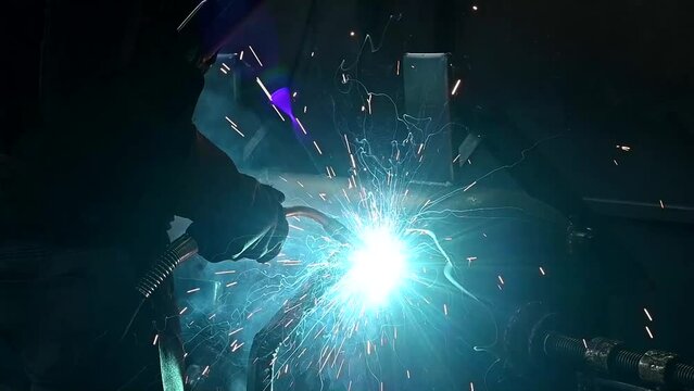 Workers welding in the factory
