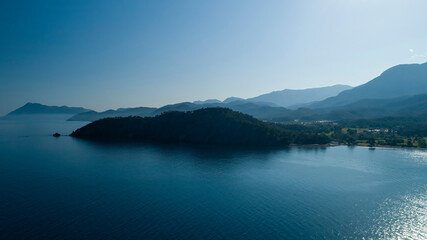 Blue sky misty weather and misty view of mountains.