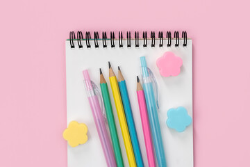 School stationery on a pink background. Back to school. Flatlay. Top view. Copy space.