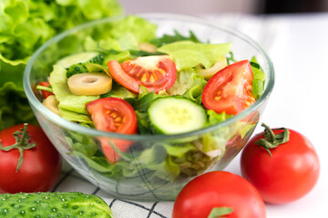 Healthy and dietary vegetable salad on the table. Healthy food concept. Close-up. Selective focus.