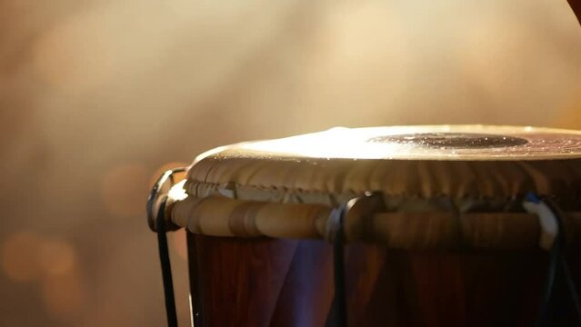 Playing Bongo Drums - Rhythmic Percussion Performance - Bokeh Background 
