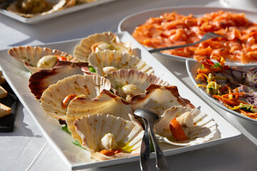 Delicious scallops with butter and herbs prepared for a catered event