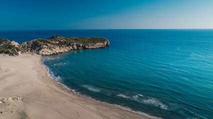 Fototapeta premium Patara is a Turkish beach famous for its giant sand dunes. Photo of Patara beach with its unique view of the deep blue sea. The beach is located in Kas district of Antalya province in Turkey.
