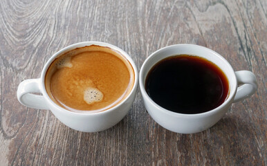 Two coffee cup, Americano coffee and espresso coffee on wooden table