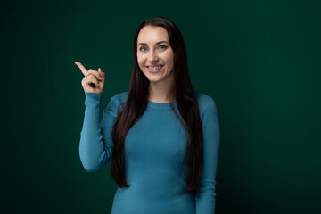 Woman in Blue Shirt Holding Peace Sign