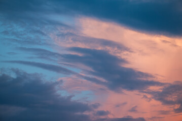 Colorful sky with clouds at sunset. Blue and rose clouds on the sky in the evening, natural background