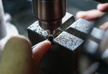 Close-up, one of the stages of manufacturing prayer beads, collect beads, Cairo Egypt 

