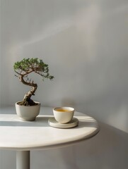 Serene Minimalism: Green Tea Cup and Bonsai Tree on White Table