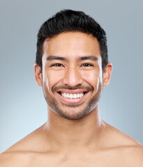Fototapeta premium Beauty, grooming and smile with portrait of man in studio on gray background for cosmetic wellness. Dermatology, natural and skincare with face of happy person in bathroom for hydration or hygiene